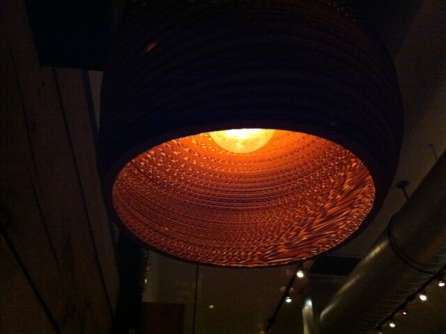 Cool lamps at dinner place made out of corrugated cardboard
