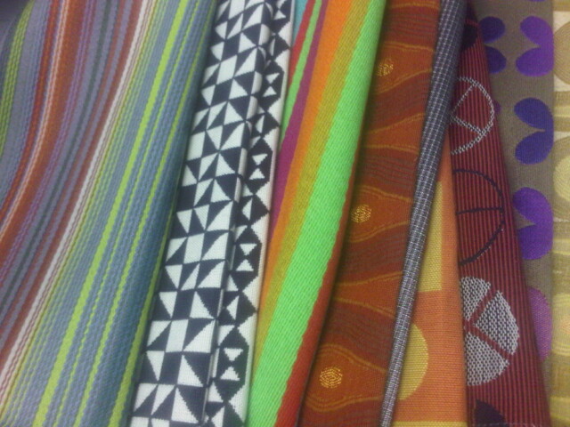 Pretty fabric swatches on the desk next to mine