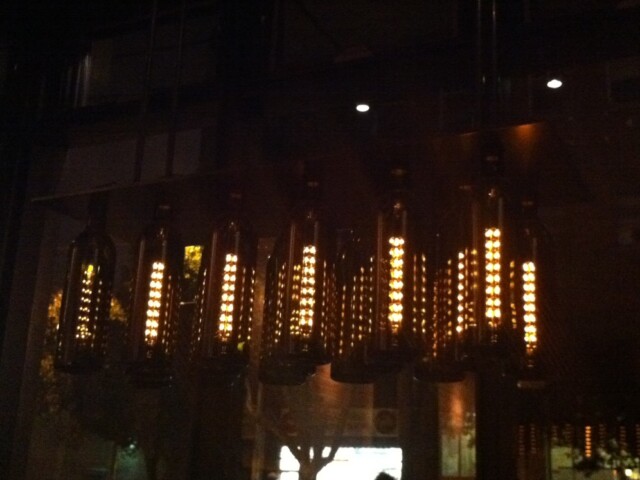 Cool wine bottle lights at bar bambino