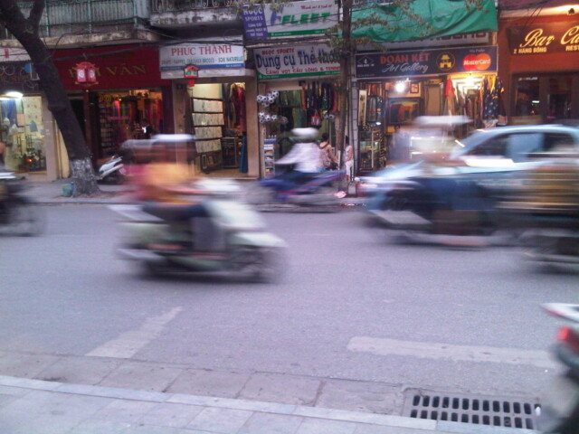 Scooters going by in Hanoi