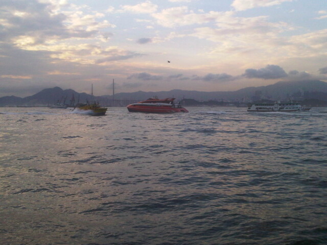 Boats and cool light out on the harbor