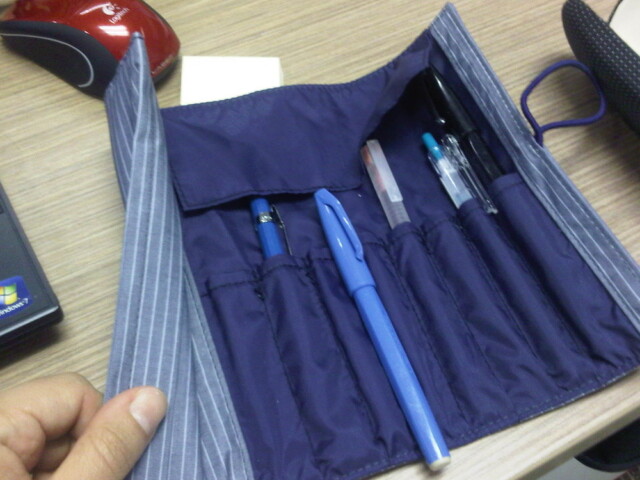 I really like my roll up pen case.